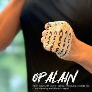 Person wearing custom branded boxing gloves with visible branding.